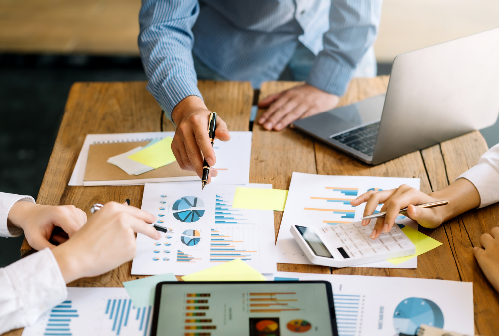 Team discussing data over charts